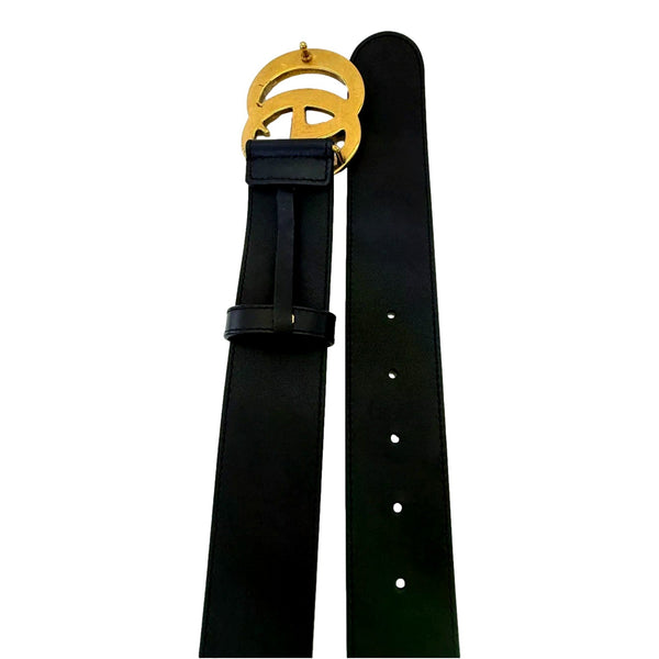 Gucci GG Marmont black leather belt showing the interior, reverse of buckle, and adjustment holes