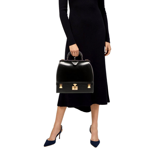Hermès vintage Sac Mallette vanity trunk top handle bag, styling view carried by the top handle
