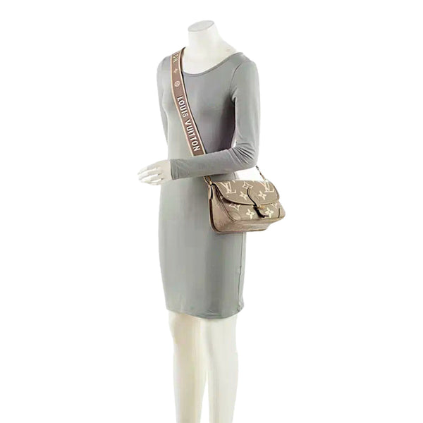 Louis Vuitton Diane Beige Monogram Empreinte Leather Crossbody Bag – carrying view