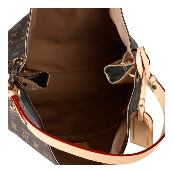 Brown textile-lined interior of the Louis Vuitton Graceful MM Monogram shoulder bag